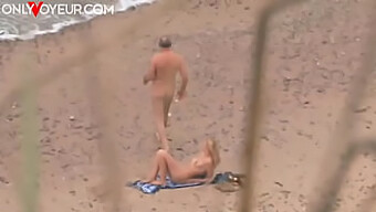 Caught In The Act: A Voyeur'S View Of A Couple On The Beach